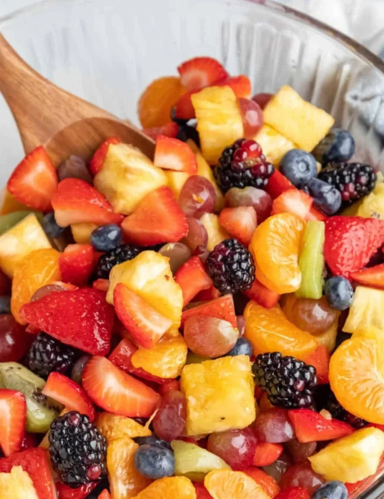 Colorful and fresh easy fruit salad served in a bowl with a mix of seasonal fruits.