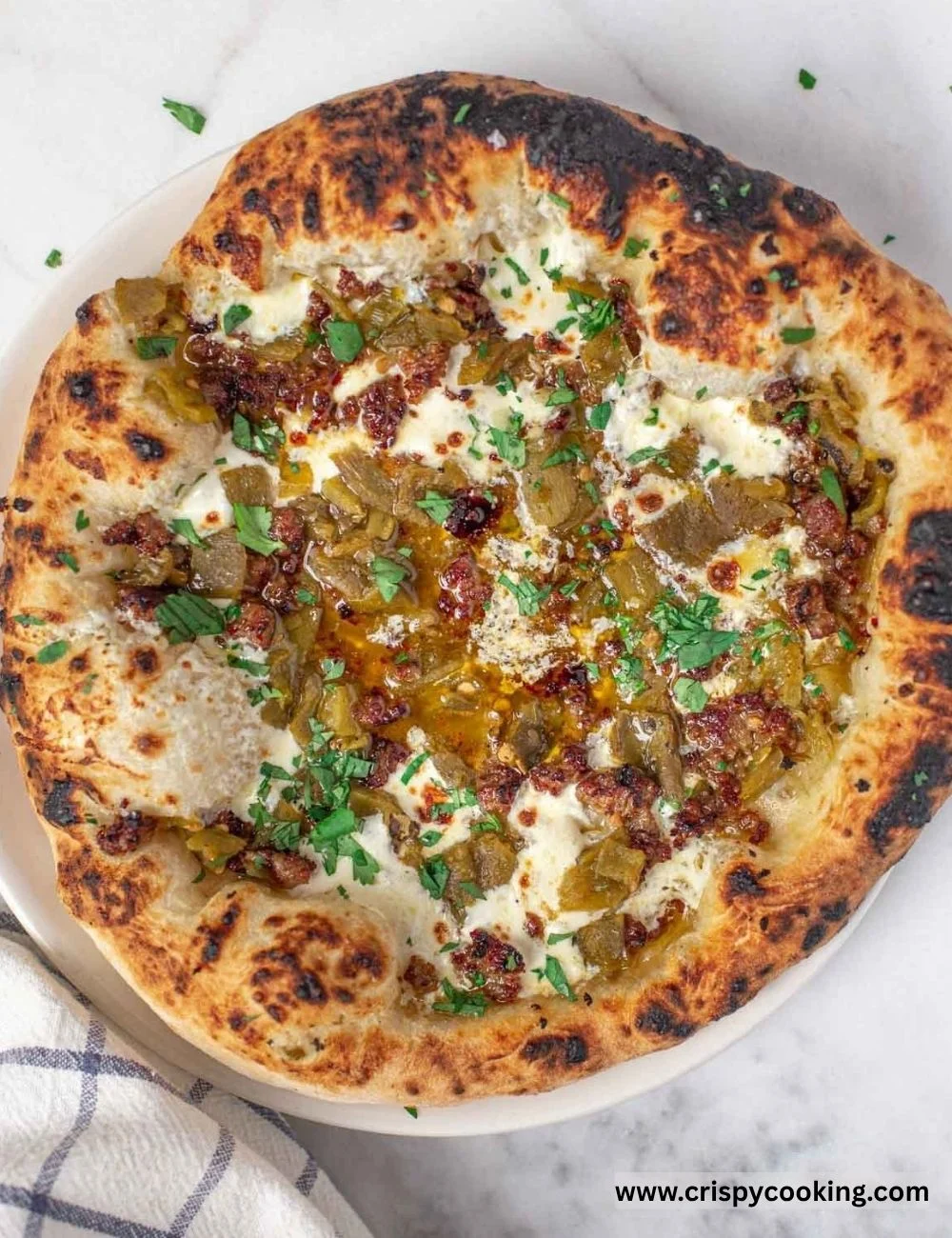 Delicious green chile pizza with chorizo sausage and fresh toppings