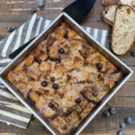 Delicious French Toast Bake topped with syrup and berries