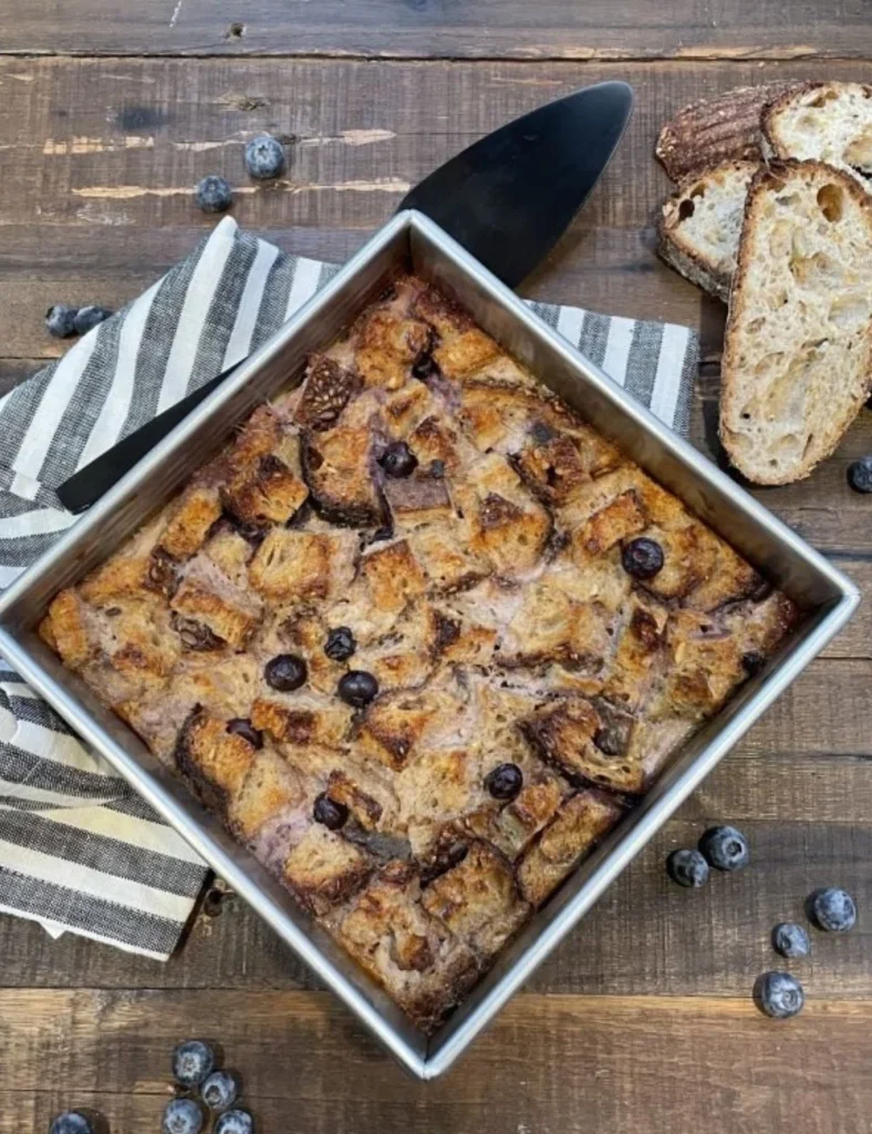 Delicious French Toast Bake topped with syrup and berries