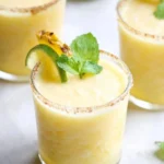 Refreshing Frozen Pineapple Margaritas in a glass with pineapple garnish