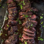 Grilled hanger steak served with vegetables and herbs