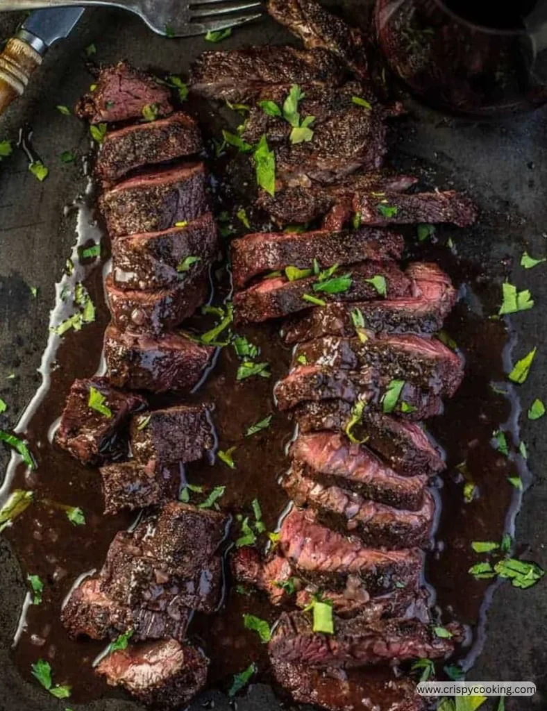 Grilled hanger steak served with vegetables and herbs