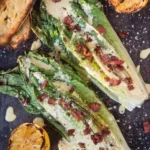 Grilled Romaine Caesar Salad with creamy dressing and croutons