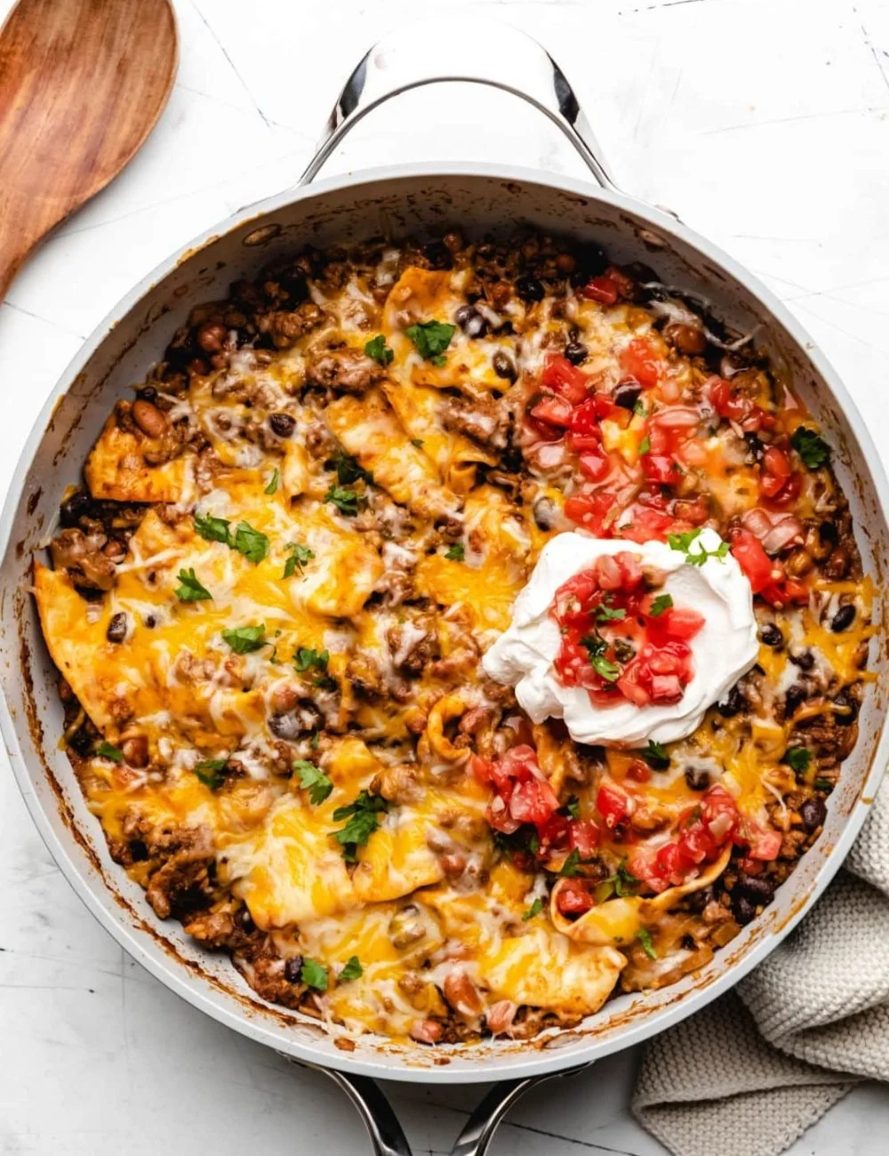Ground Beef Burrito Skillet with rice, beans, and cheese in a colorful presentation