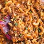 Delicious homemade hamburger helper served in a bowl with a sprinkle of cheese.