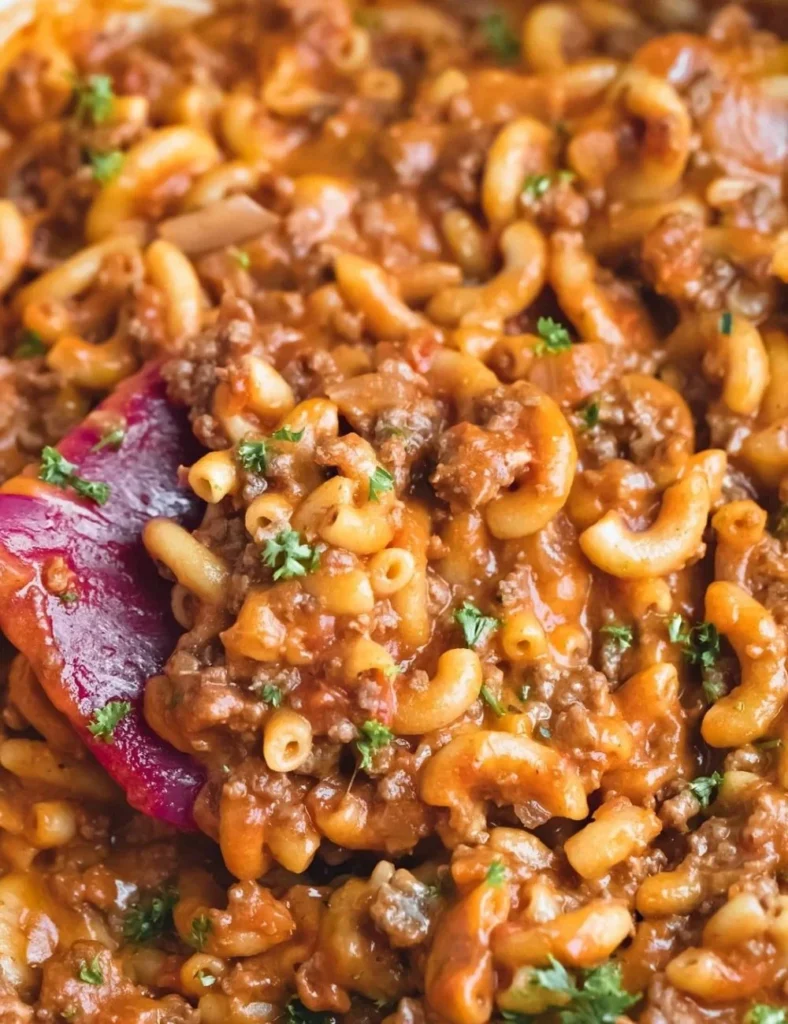 Delicious homemade hamburger helper served in a bowl with a sprinkle of cheese.