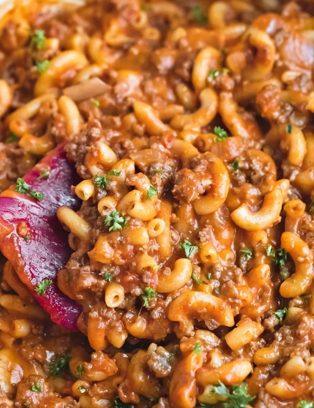 Delicious homemade hamburger helper served in a bowl with a sprinkle of cheese.