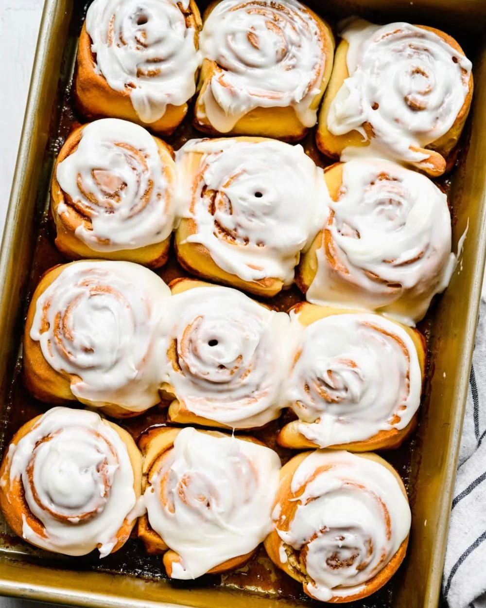 Freshly baked honey buns with a golden glaze and fluffy texture