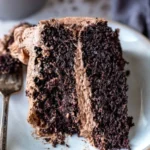 Delicious hot chocolate cake topped with chocolate ganache and whipped cream