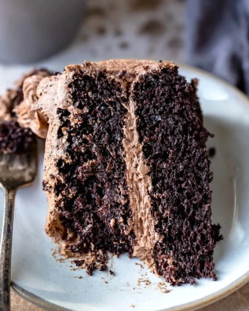 Delicious hot chocolate cake topped with chocolate ganache and whipped cream