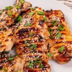 Delicious Korean BBQ Chicken served on a grill with vibrant vegetables.