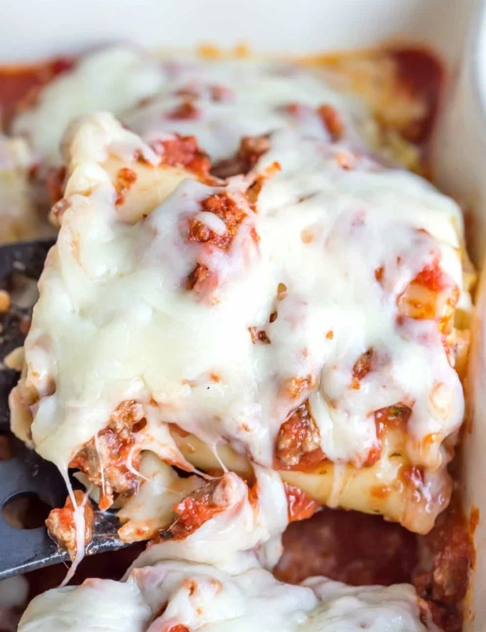 Delicious Lasagna Roll Ups baked with cheese and meat sauce