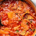 Delicious homemade Lasagna Soup garnished with herbs in a bowl.