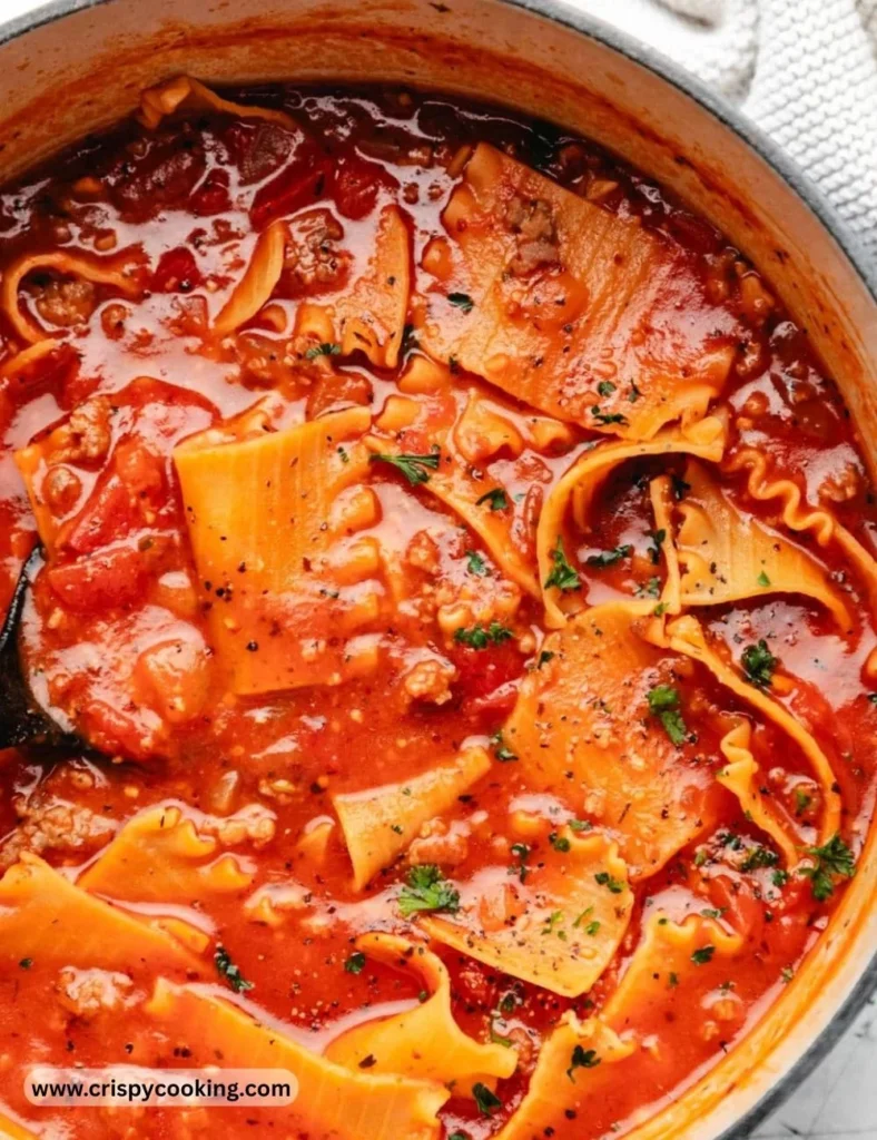 Delicious homemade Lasagna Soup garnished with herbs in a bowl.