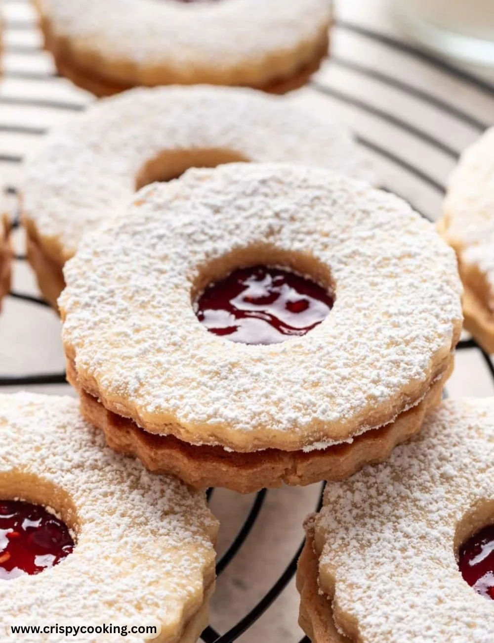 Delicious Linzer Cookies with jam filling and powdered sugar topping