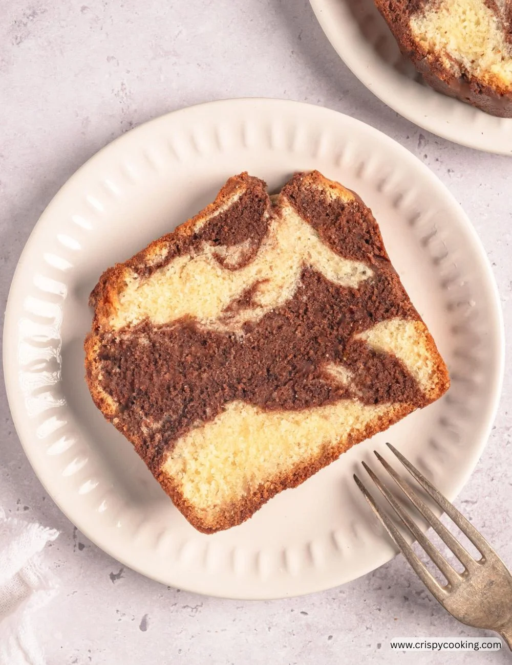 Deliciously swirled marble cake with chocolate and vanilla flavors.
