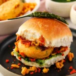 Delicious Mumbai Vada Pav served with chutney and green chili