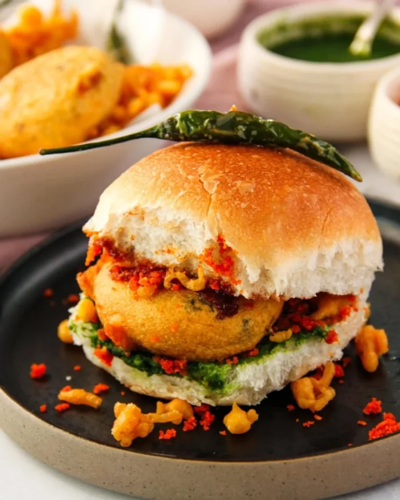 Delicious Mumbai Vada Pav served with chutney and green chili