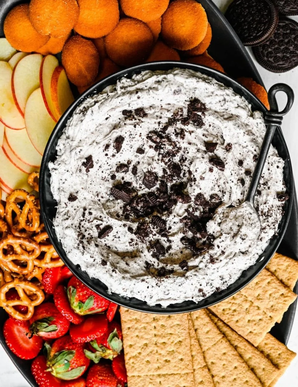 Delicious bowl of Oreo Fluff dessert topped with crushed Oreos.