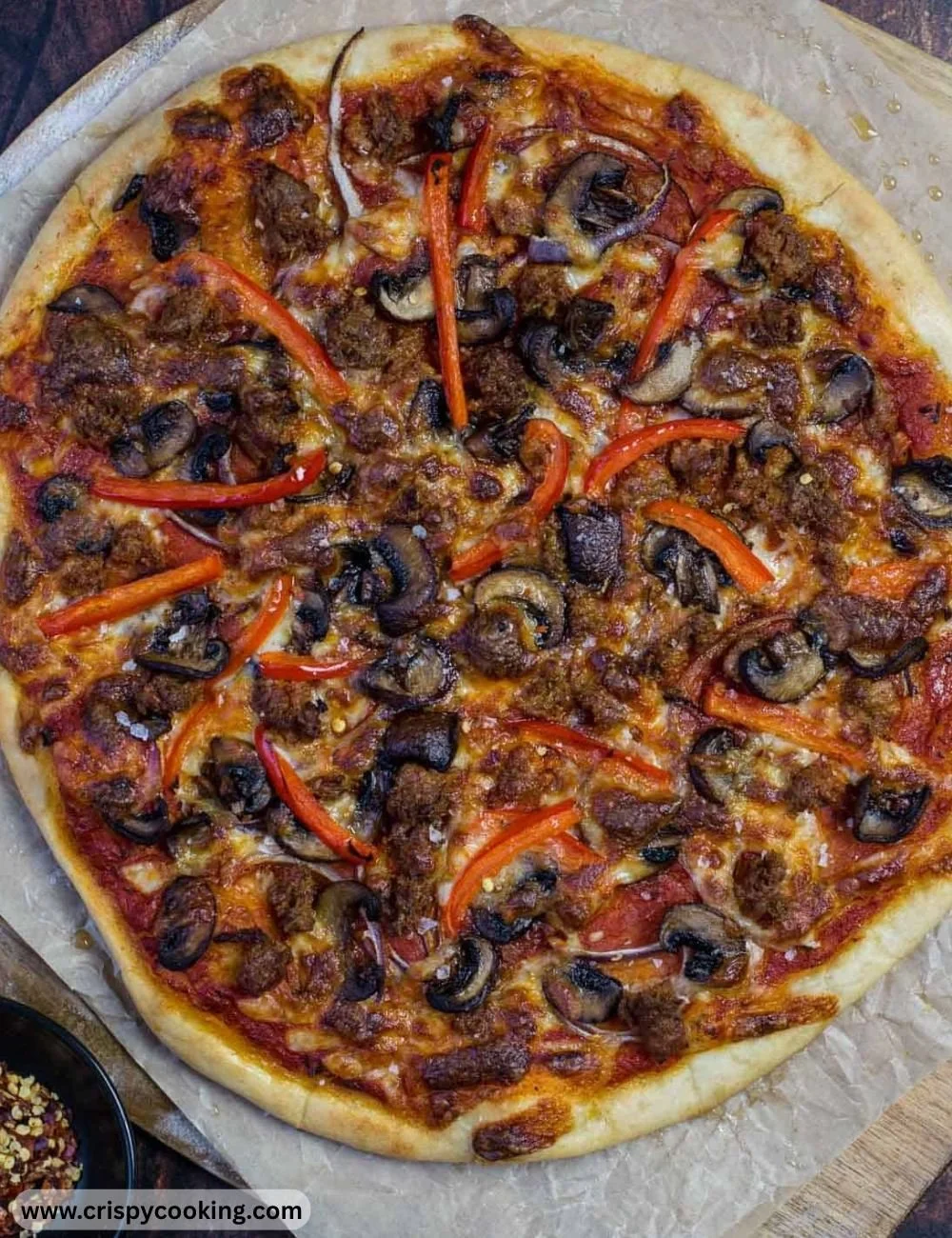 Homemade pizza cooked on a pellet grill with smoky flavor and crispy crust.