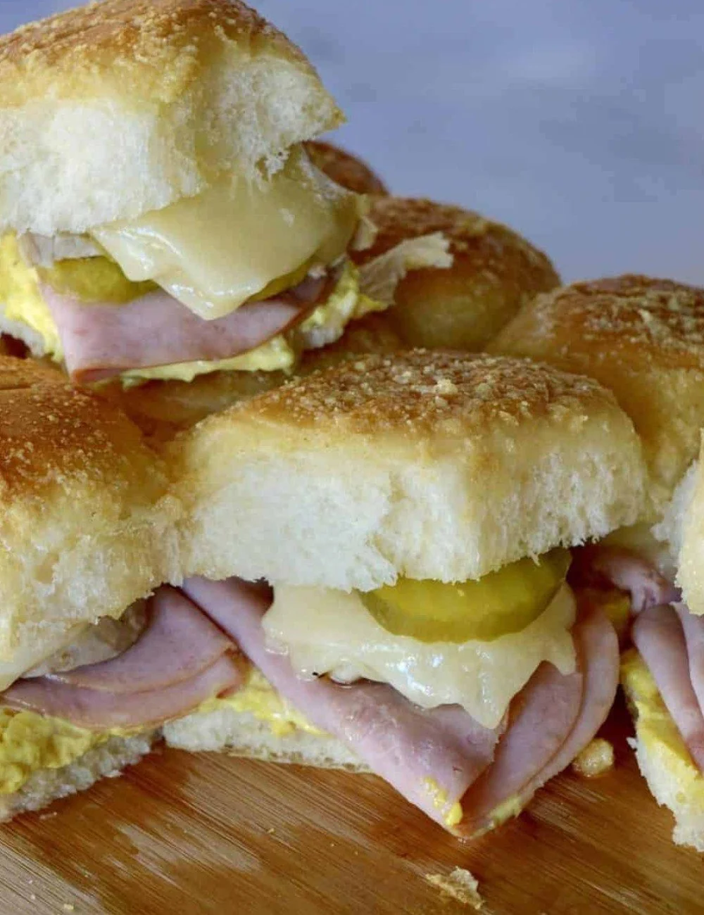 Delicious Pull Apart Cuban Sliders with pork, cheese, and mustard on a platter