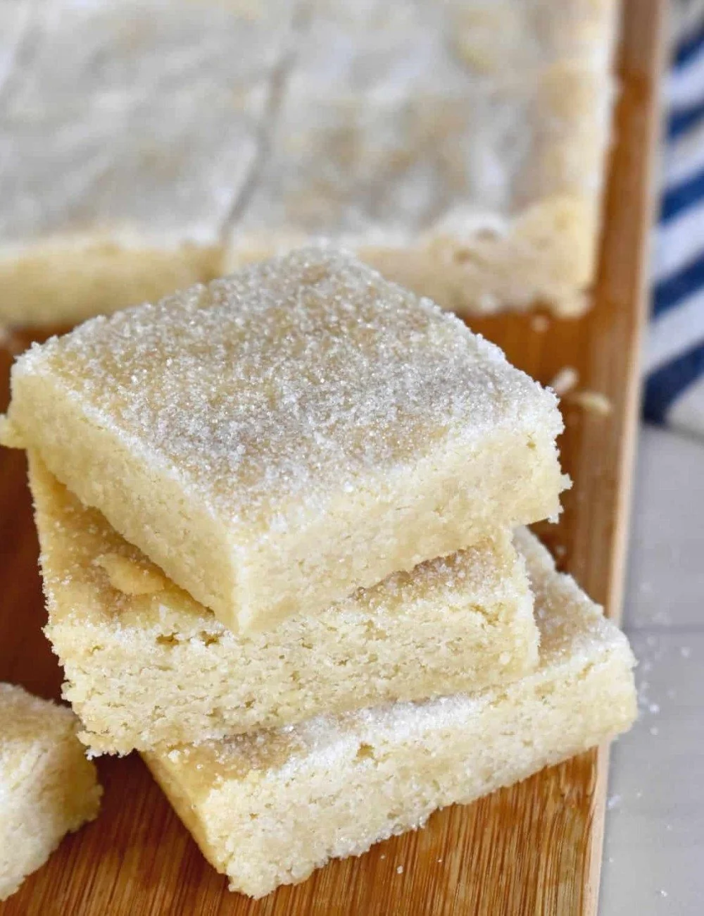 Delicious shortbread cookie bars topped with a drizzle of chocolate