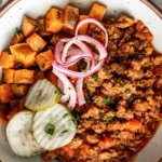Delicious Sloppy Joe Bowls served with fresh toppings in a rustic bowl.