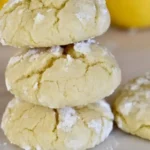 Delicious soft lemon cookies on a plate, showcasing their bright yellow color.