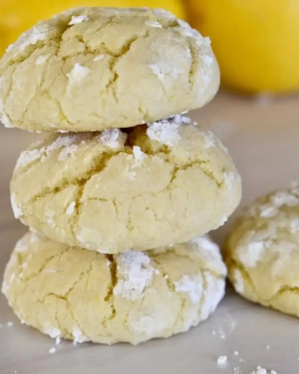 Delicious soft lemon cookies on a plate, showcasing their bright yellow color.