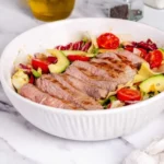 Fresh steak salad with mixed greens and vibrant vegetables