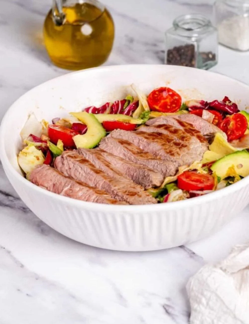 Fresh steak salad with mixed greens and vibrant vegetables