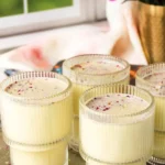 Chilled Thandai drink served with traditional Indian garnishes