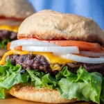 Delicious homemade venison burger with fresh toppings and gourmet presentation.