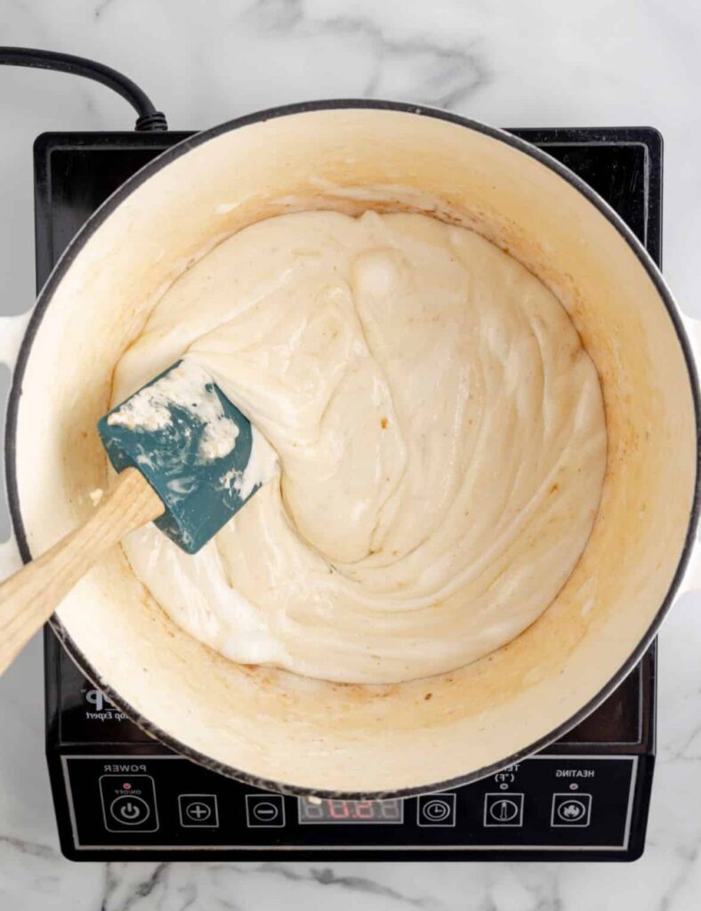 Transfer the mixture into a greased 9x13-inch pan. Using a spatula or your hands (lightly greased), press the mixture evenly into the pan.
