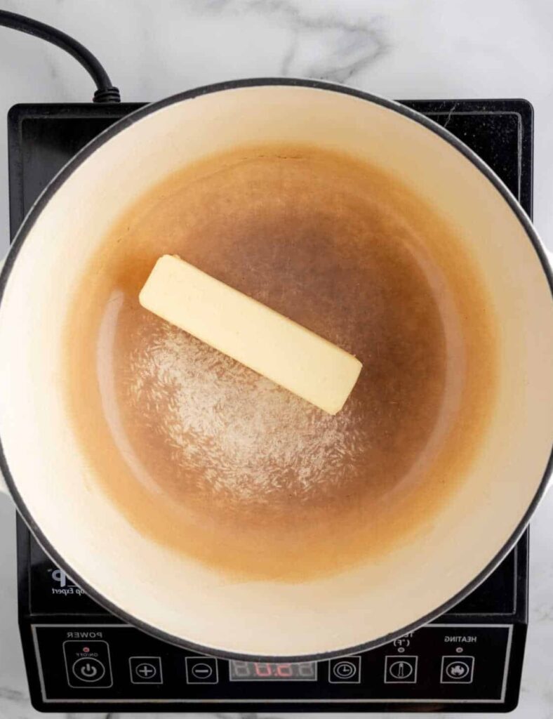 In a large pot over medium heat, melt the unsalted butter. Stir occasionally until it starts to turn golden brown and releases a nutty aroma.