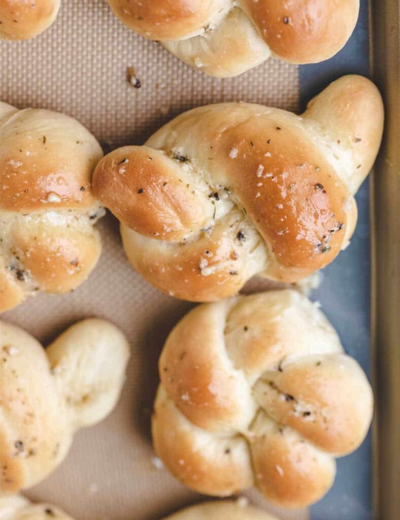 Freshly made homemade garlic knots with herbs and garlic butter