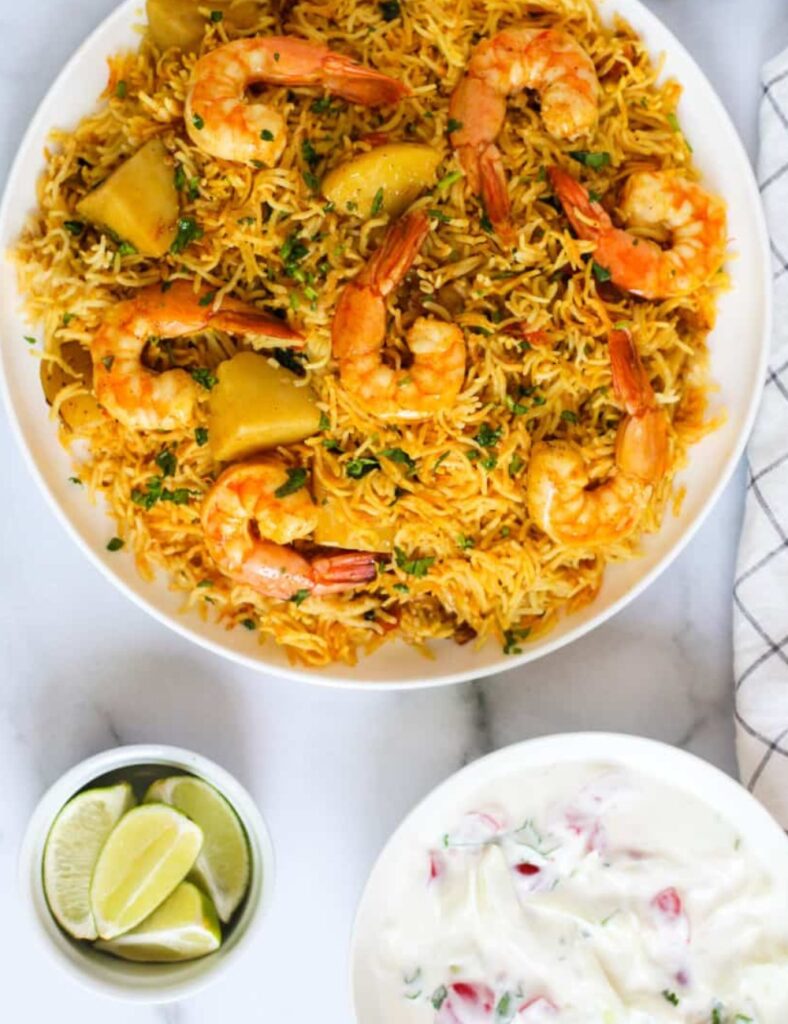Delicious Instant Pot Shrimp Biryani served in a bowl, garnished with herbs.