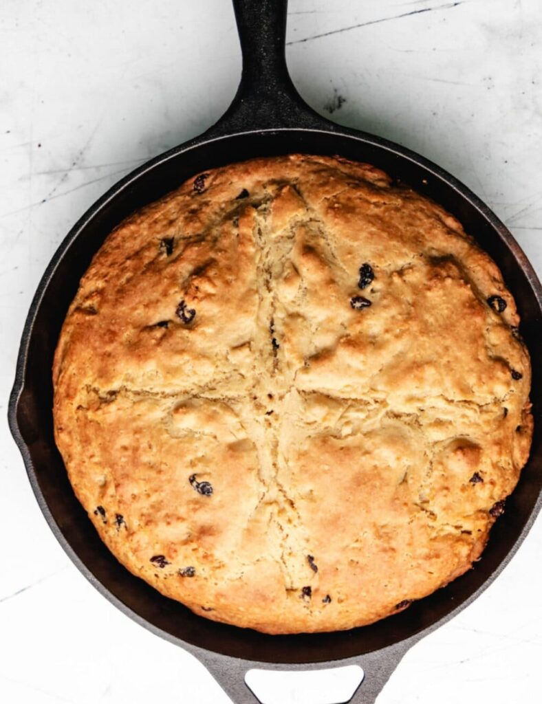 Using a sharp knife, cut a deep cross into the top of the loaf. This not only looks beautiful, but it also helps the bread rise while baking.