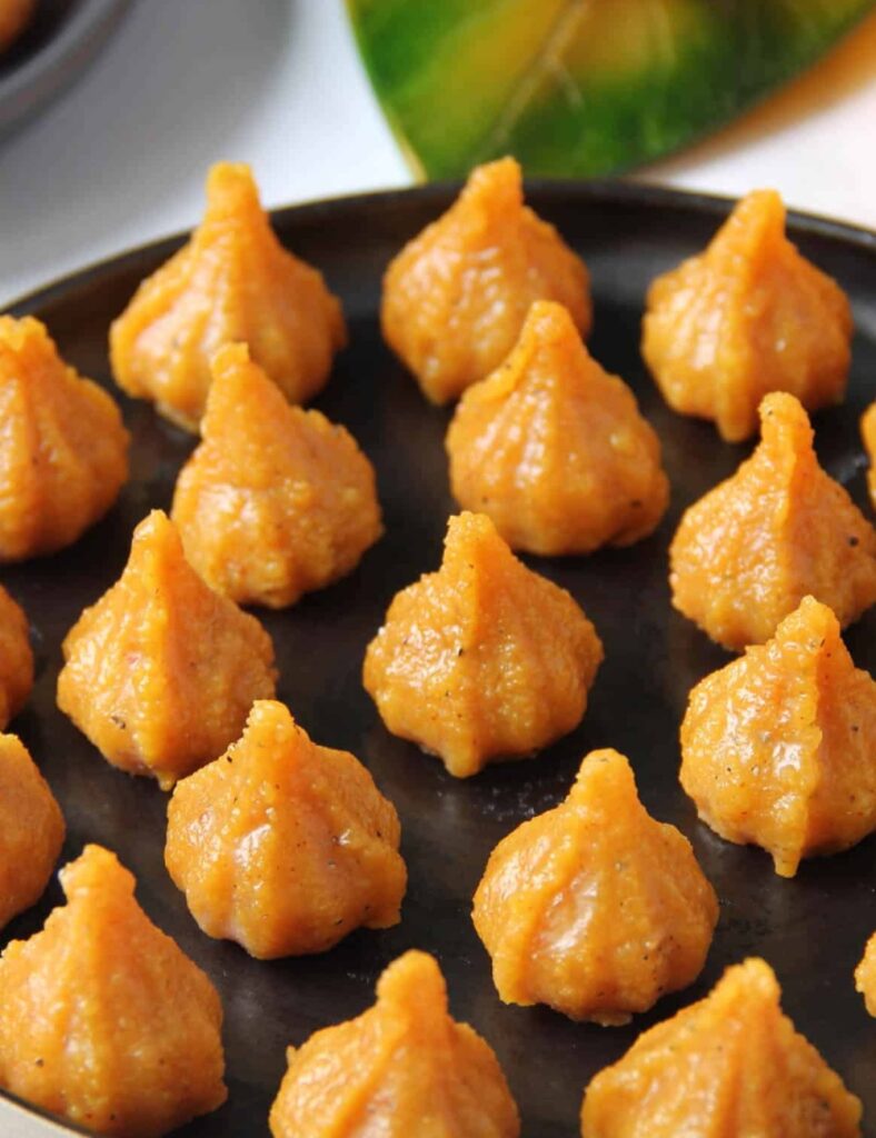 Delicious Mawa Modak sweets served on a traditional platter.