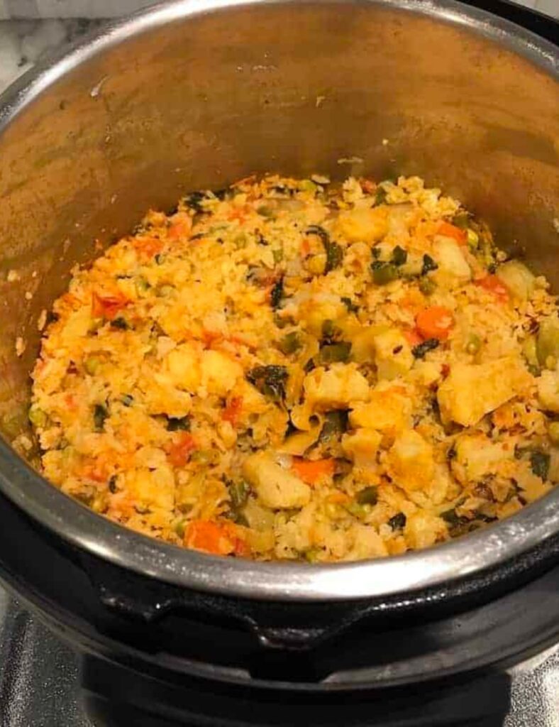 A large pot brimming with rich soup and assorted vegetables, indicating a nutritious and comforting dish.