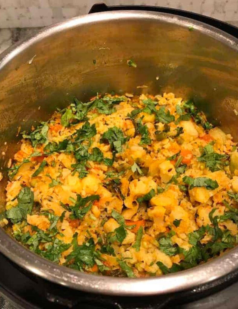 A pot containing a vibrant mix of vegetables in a savory soup, highlighting a wholesome culinary creation.