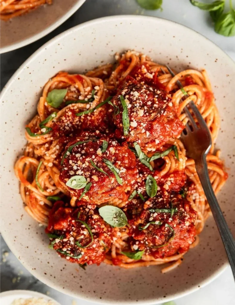 Delicious baked Italian meatballs served on a wooden platter