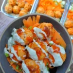Buffalo Chicken Meatball Bowls with dipping sauce and fresh vegetables