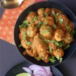 Delicious Chicken Meatball Curry served with rice in a bowl