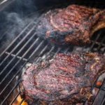 Juicy grilled Cowboy Ribeye Steak served on a plate