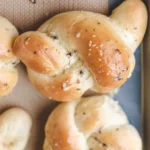 Freshly made homemade garlic knots with herbs and garlic butter