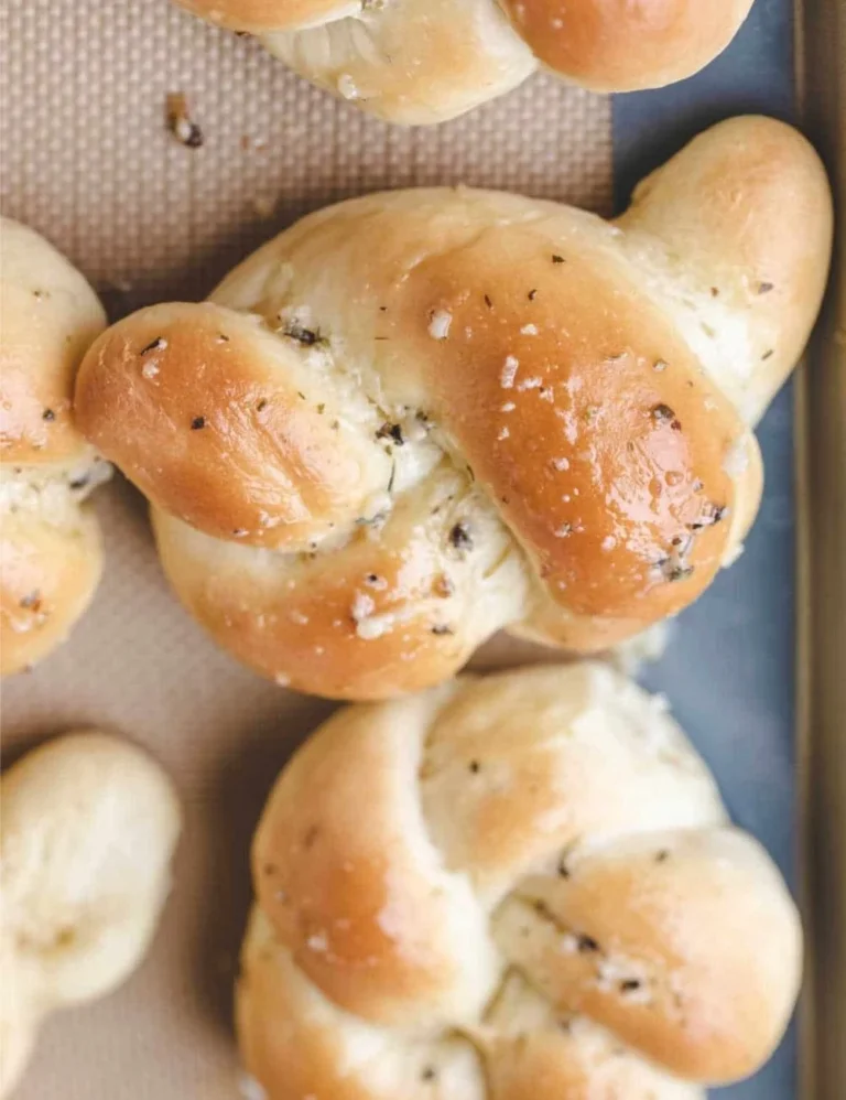 Freshly made homemade garlic knots with herbs and garlic butter