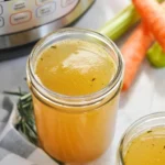 Delicious Instant Pot bone broth in a bowl with herbs and spices