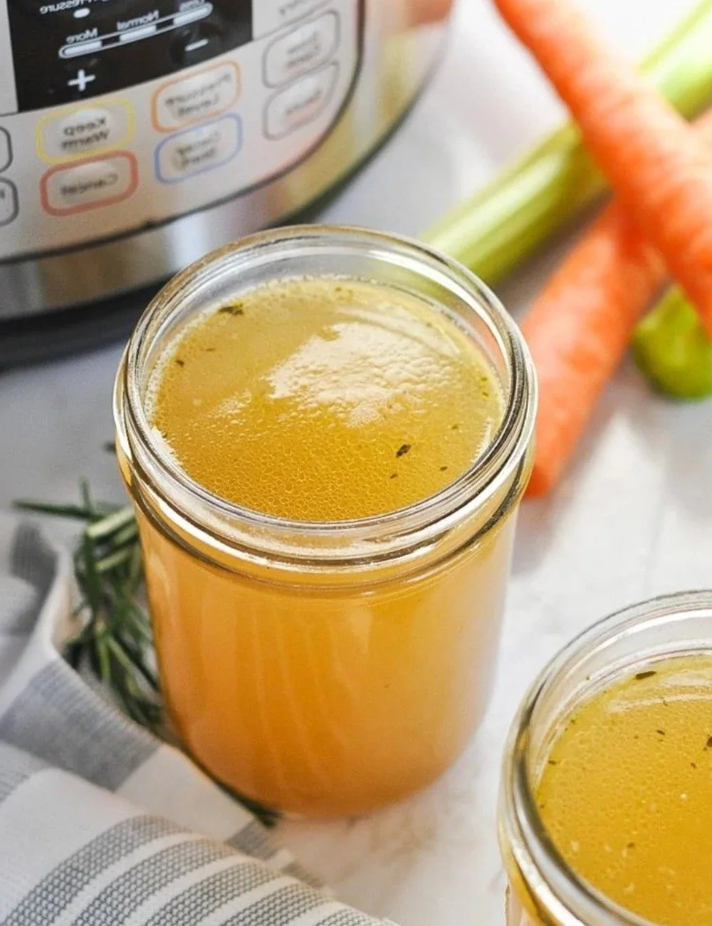 Delicious Instant Pot bone broth in a bowl with herbs and spices